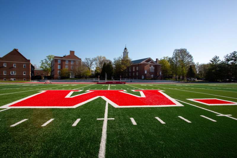 a football field with a red logo