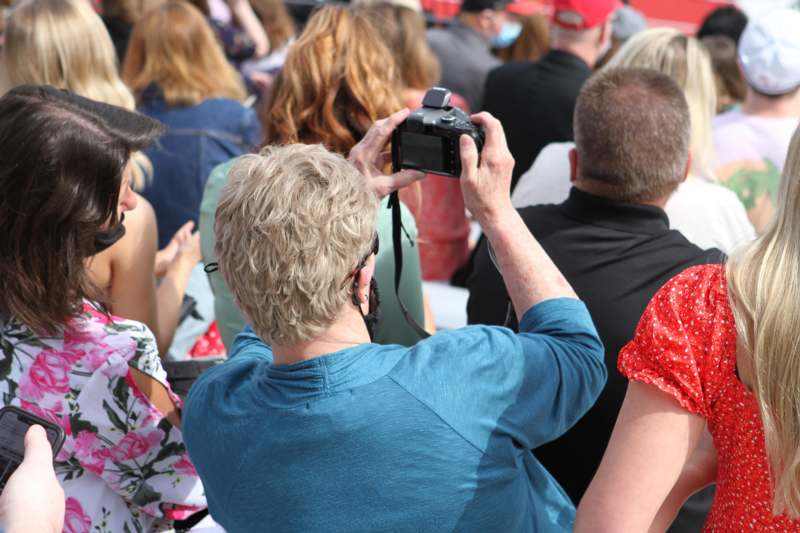 a man taking a picture of a crowd