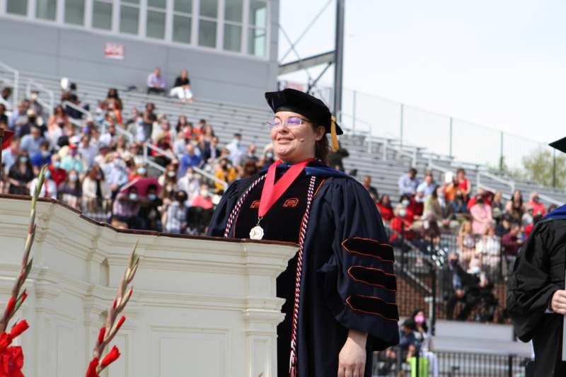 a woman in a graduation gown