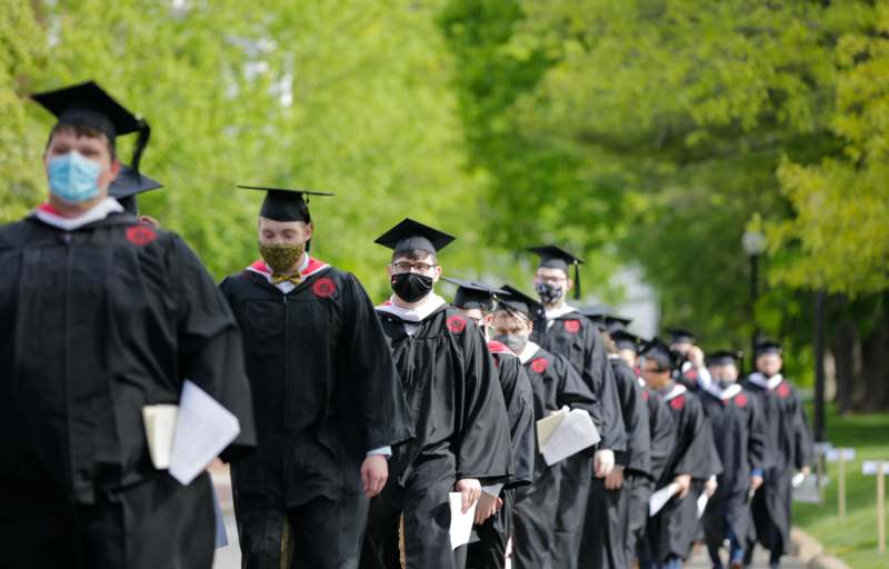 a group of people wearing caps and gowns