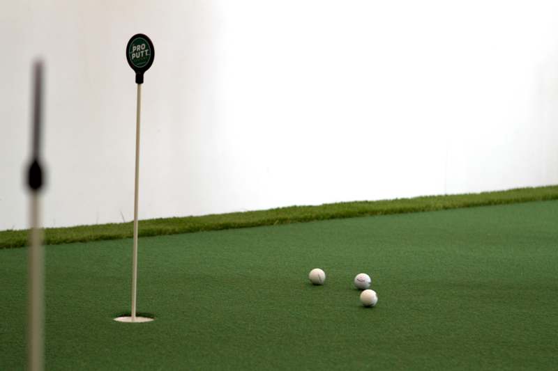 a golf balls on a green surface