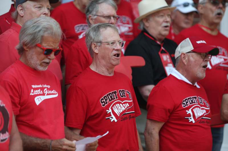 a group of people wearing red shirts