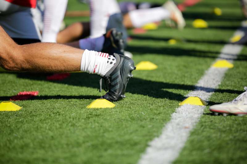 a football player's foot on a field