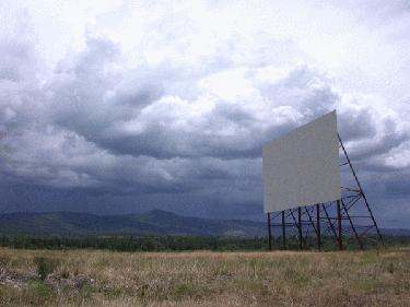 a large billboard in a field