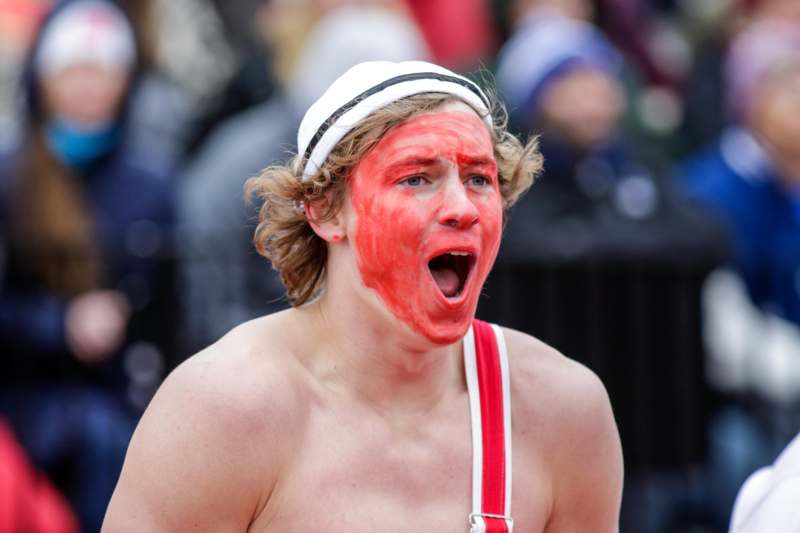 a man with red face paint