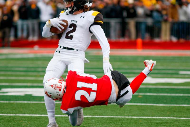 a football player falling off the ground