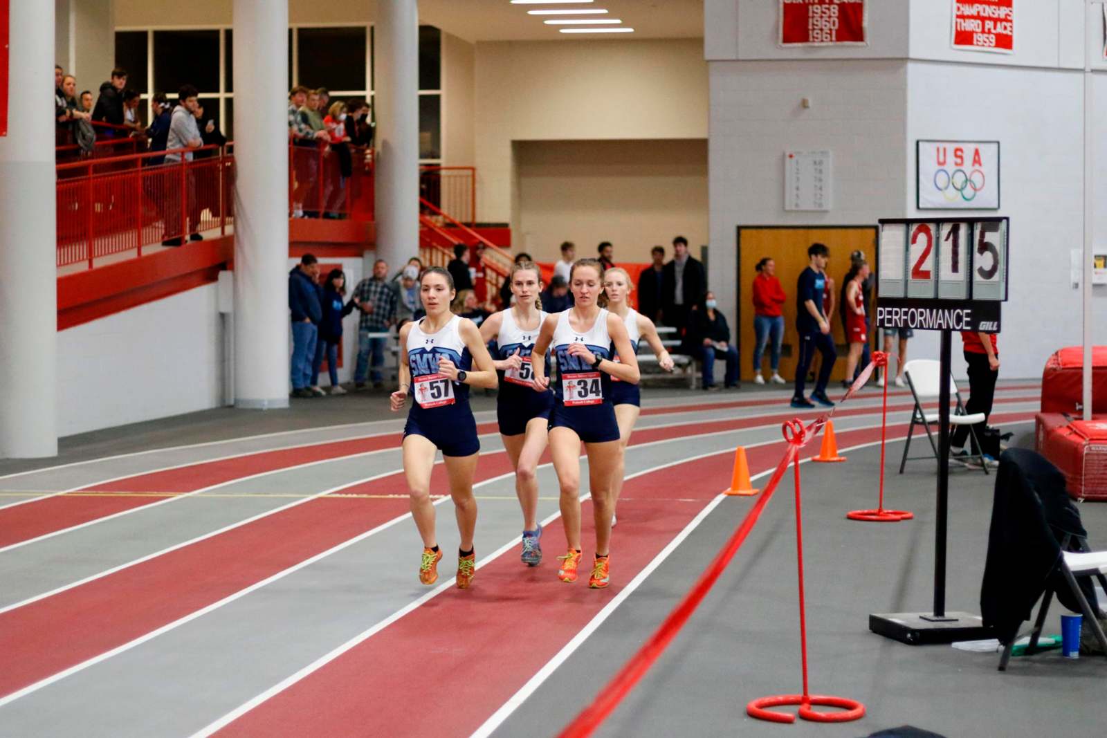 a group of girls running on a track