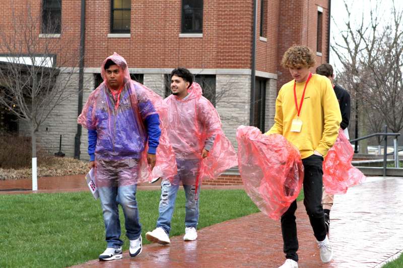 a group of people wearing plastic ponchos
