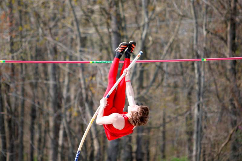 a person in red tights from a pole