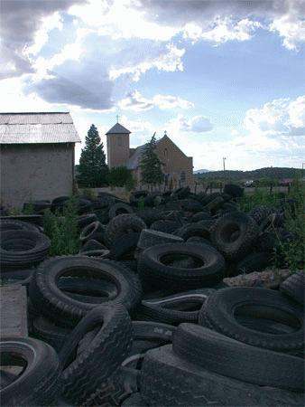a pile of tires in a field