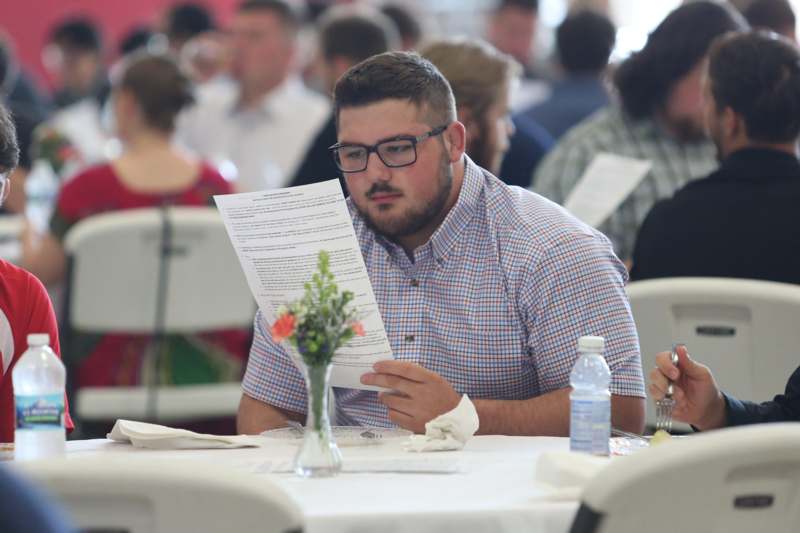 a man reading a paper