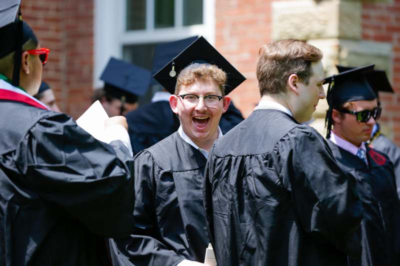 a group of people wearing graduation gowns