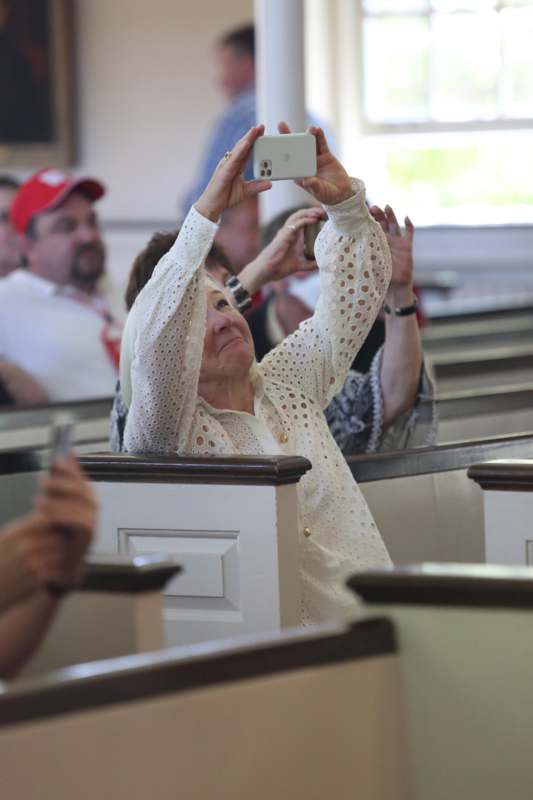 a woman taking a selfie with a cellphone