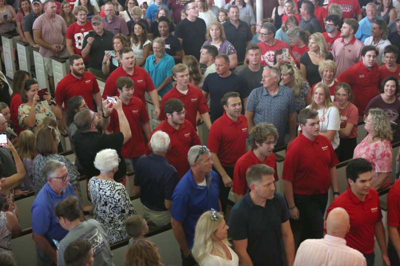 a group of people standing in a crowd