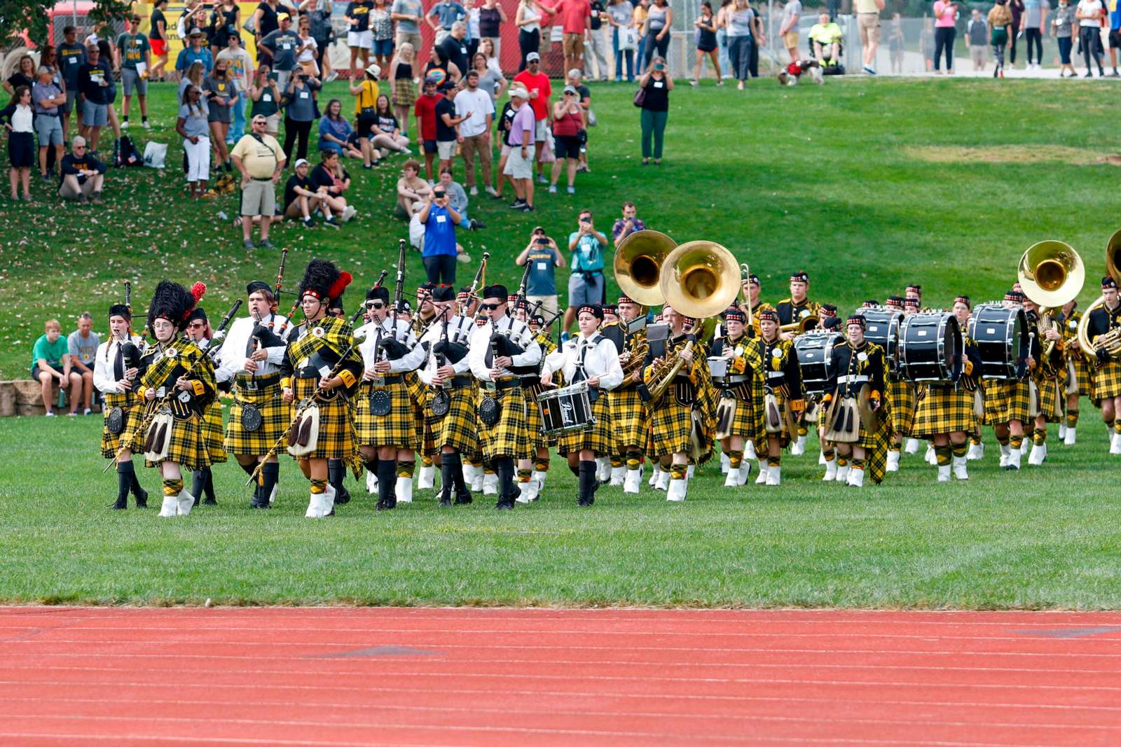 a group of people in uniform playing instruments