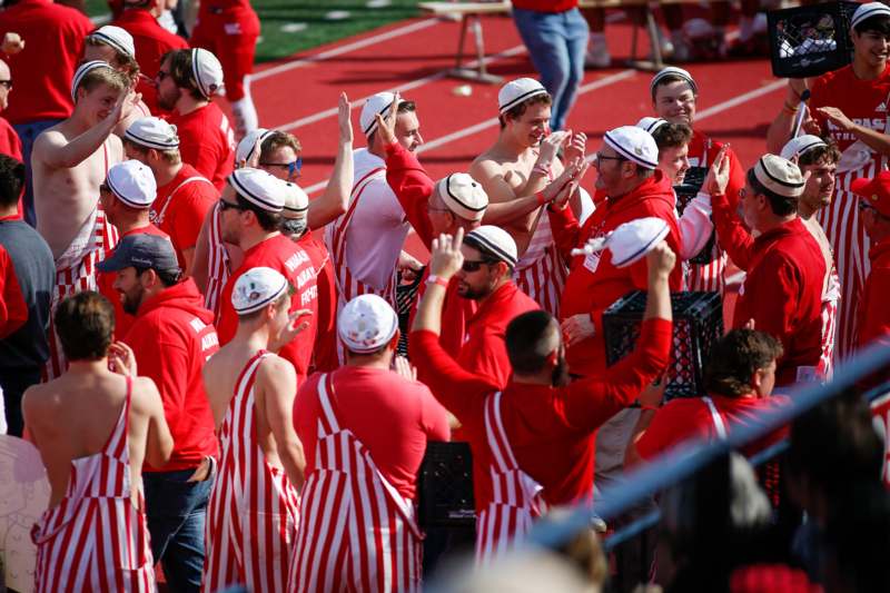 a group of people in red and white uniforms