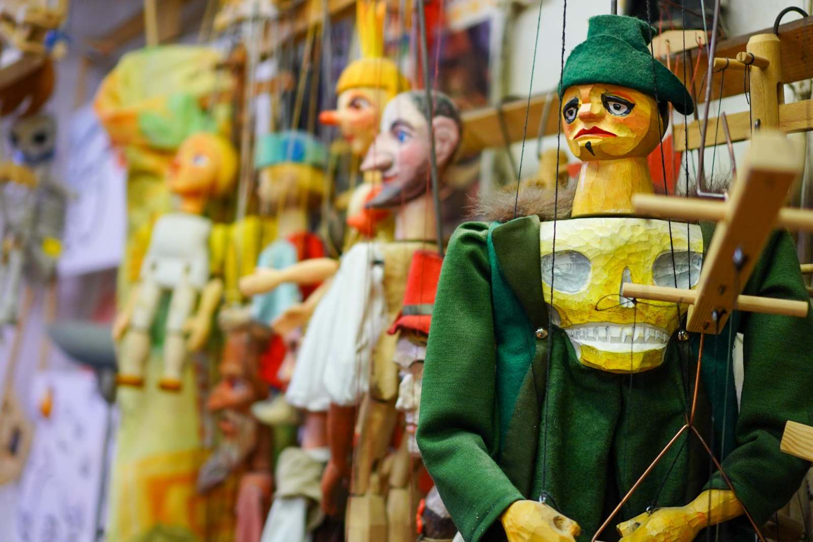 a group of puppets from strings