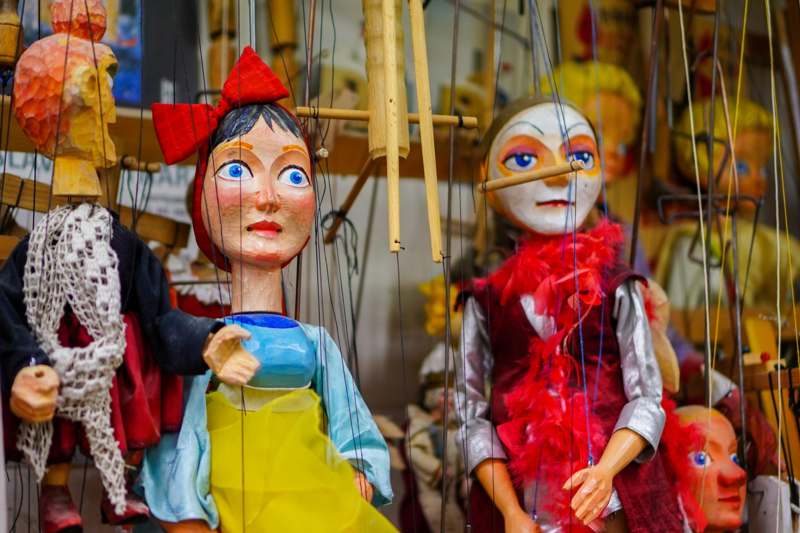 a group of puppets in a store