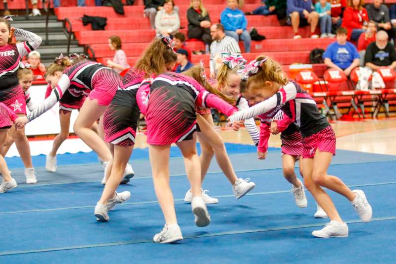 a group of cheerleaders in a competition
