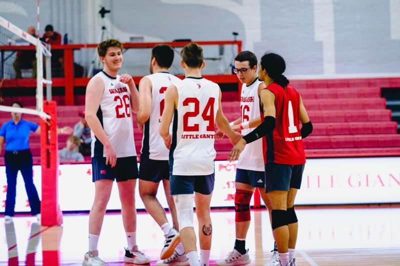 a group of people in sports uniforms