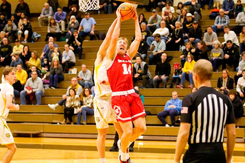 a basketball player in red and white playing basketball