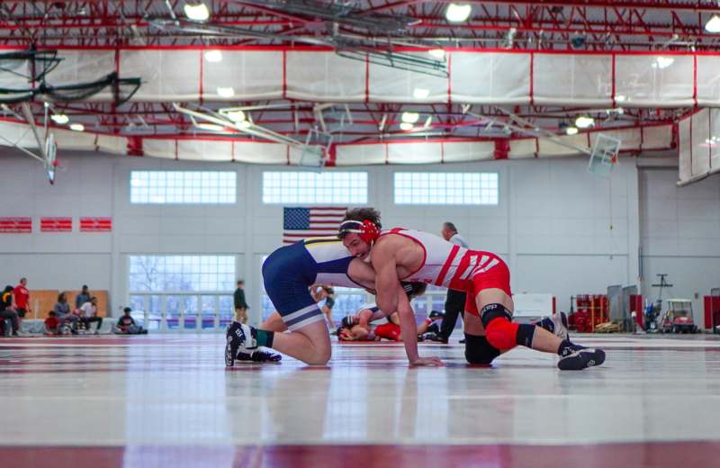 a group of people wrestling in a gym