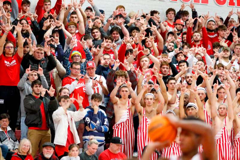 a large group of people in red and white