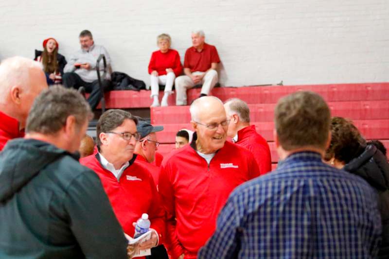 a group of people in red jackets