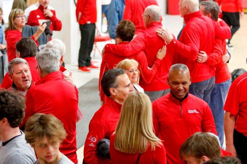 a group of people in red jackets