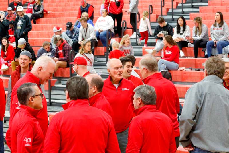 a group of people in red jackets