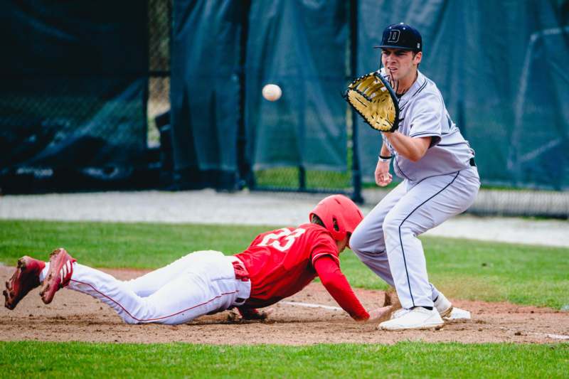 a baseball player sliding into base