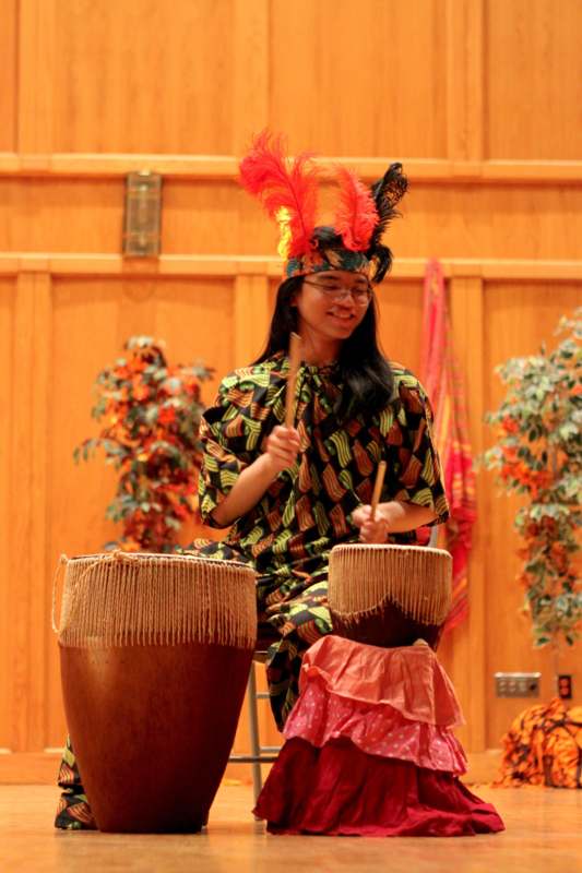 a woman playing drums