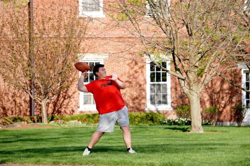 a man throwing a football