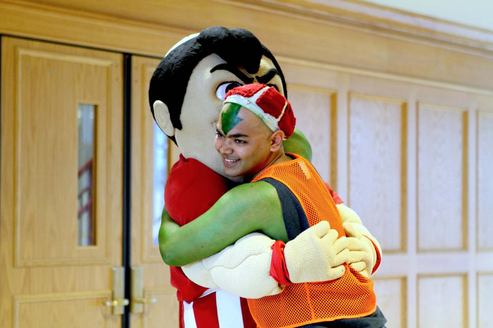 a man hugging a person in a garment