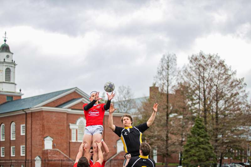 a group of people playing rugby