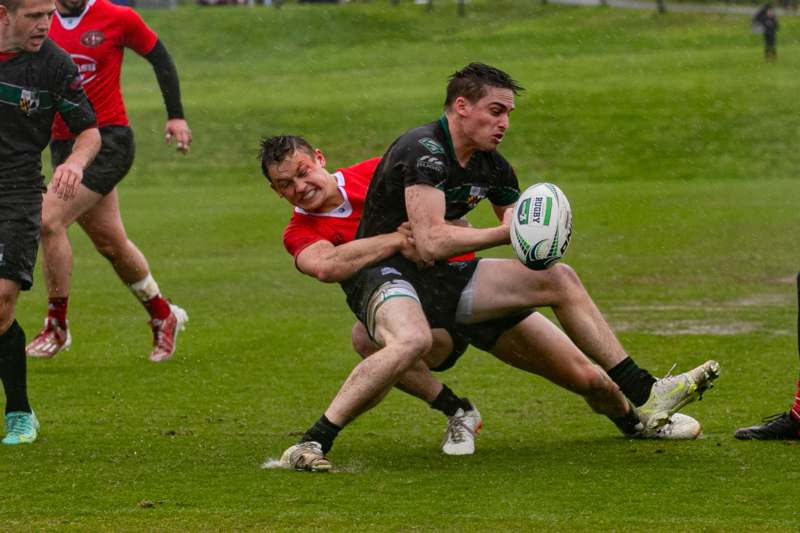 a group of men playing rugby