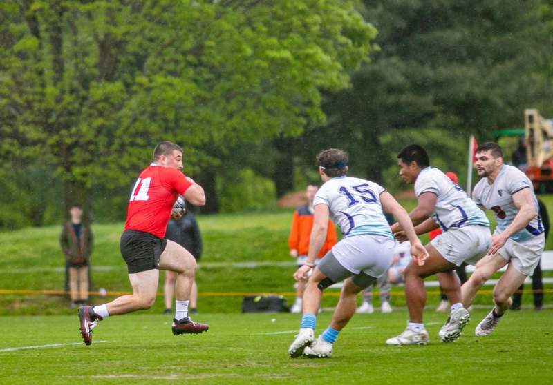 a group of people playing rugby