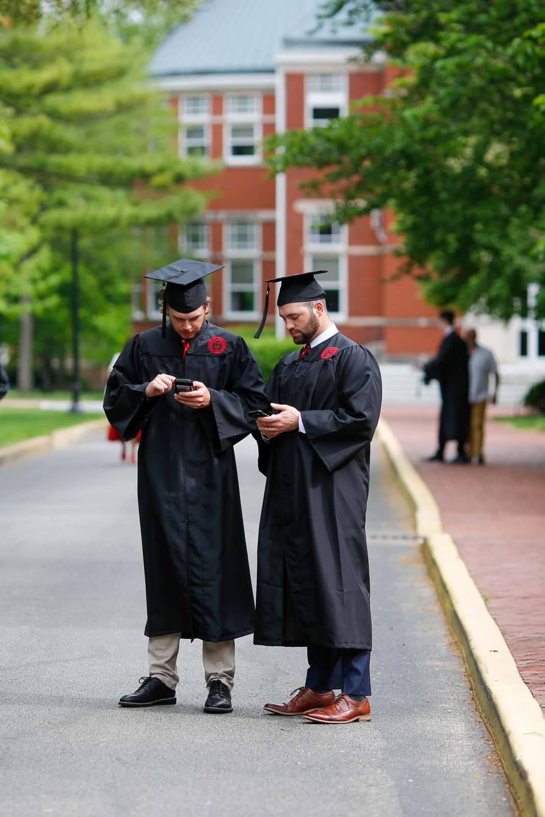 Free Photos - This Stock Photo Captures Two Young Men In Cap And Gowns, Who  Have Just Graduated From The University Of Wisconsin-Madison. They Are  Standing Side By Side, Proudly Displaying Their