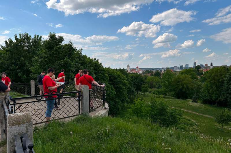 a group of people standing on a bridge