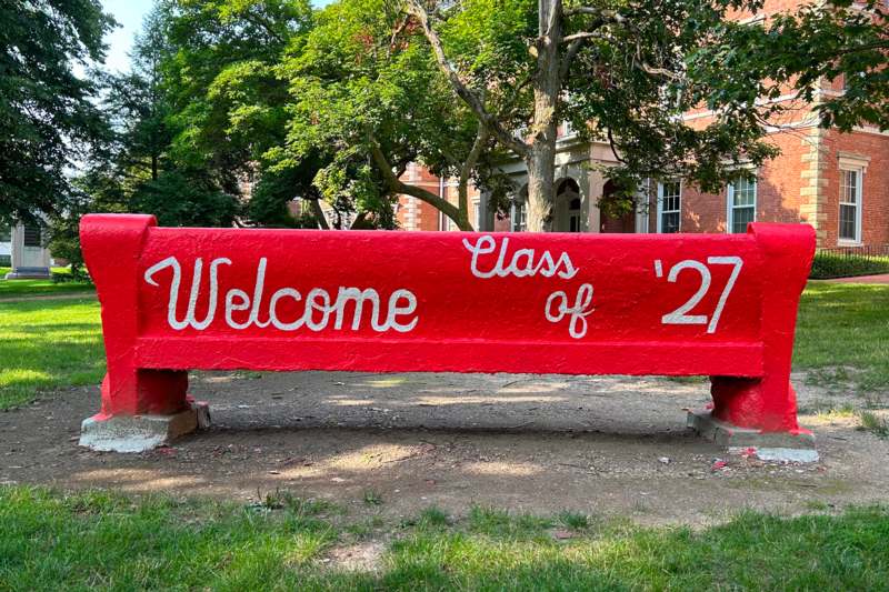 a red bench with white text on it