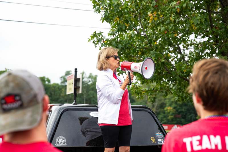 a woman speaking into a megaphone