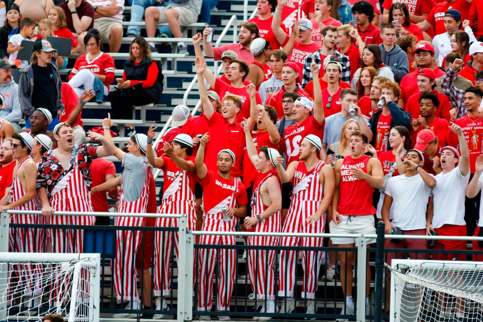 a group of people in red and white striped uniforms