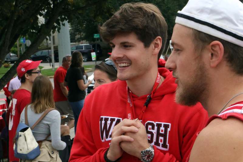 a man in a Wabash College sweatshirt smiling