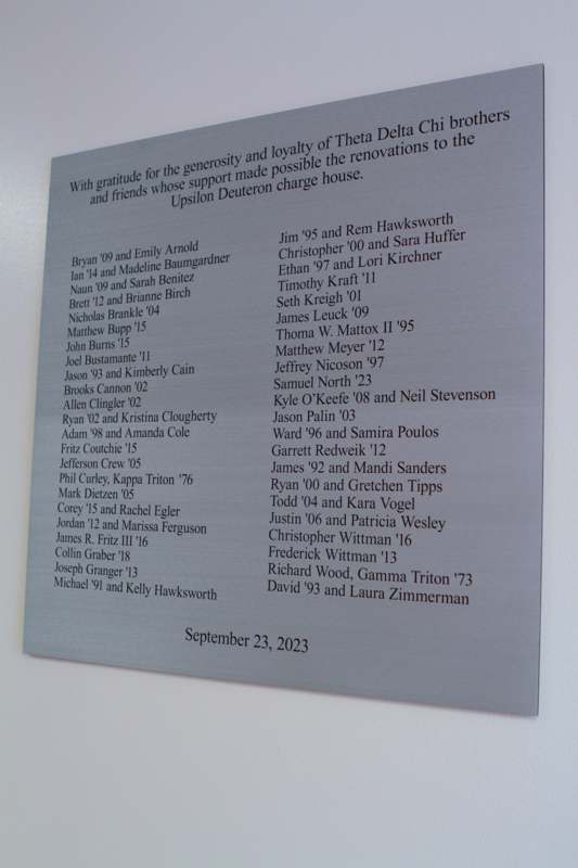 a plaque with names and a date