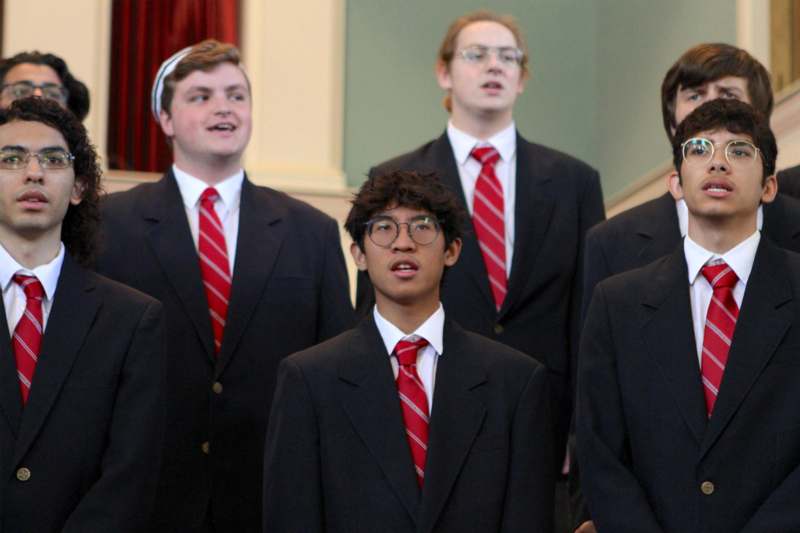 a group of men wearing suits and ties