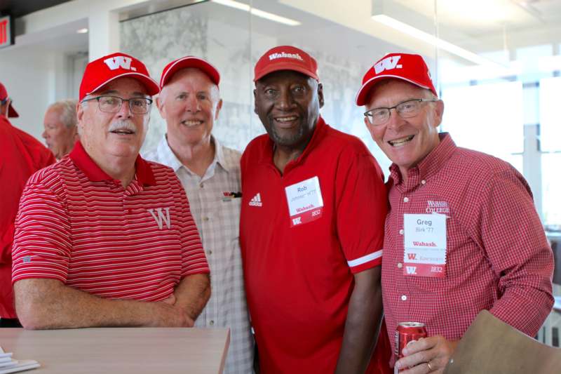 a group of men wearing matching red and white outfits