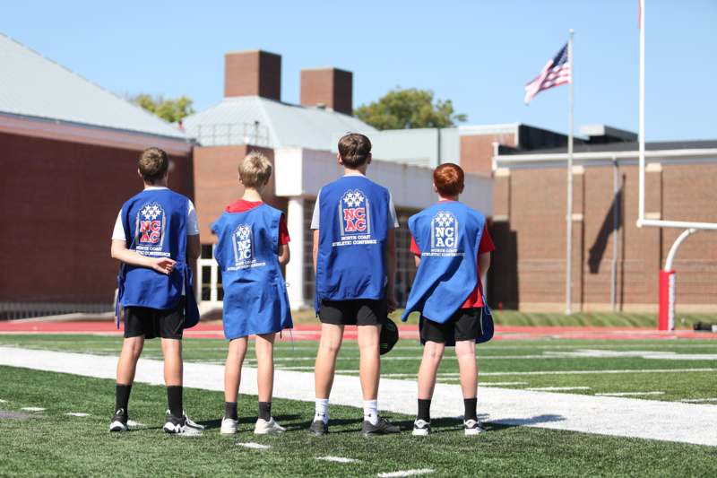 a group of boys on a football field