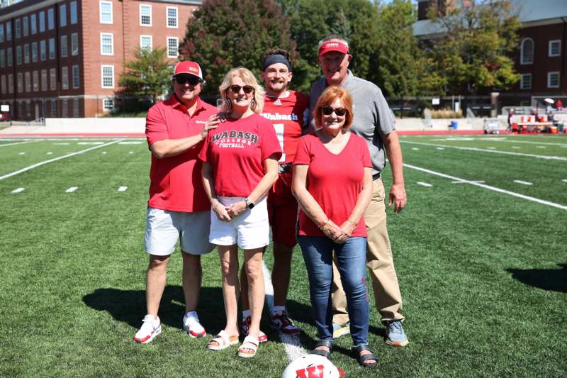 a group of people standing on a football field