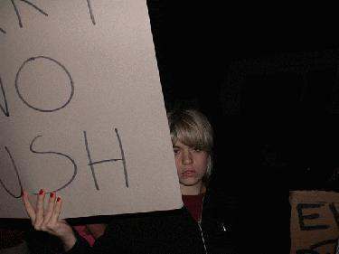 a woman holding a sign