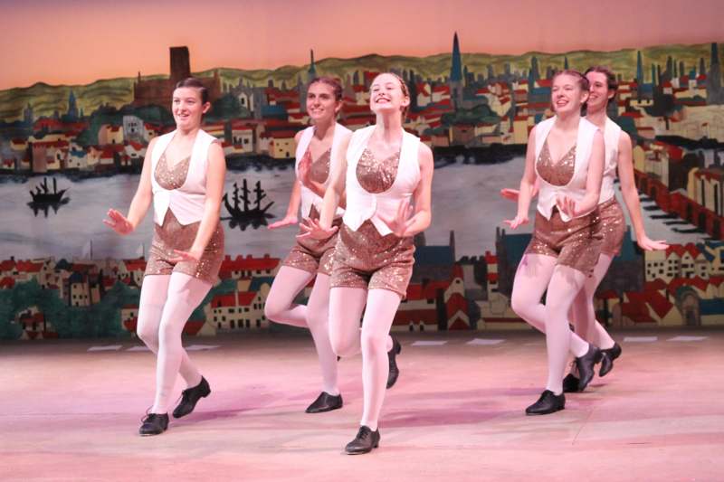 a group of women dancing on a stage